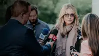 Backdrop to the movie "Escaping the NXIVM Cult: A Mother