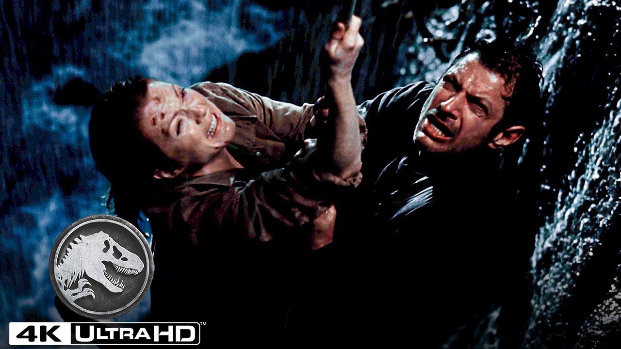 Watch film The Lost World: Jurassic Park | A Family of T. Rexes Pushes Ian Malcolm Off of a Cliff